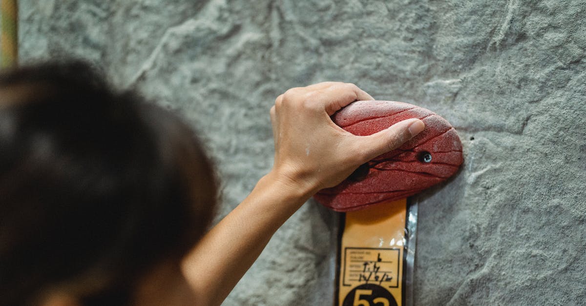 What determines which players participate in a penalty shootout in FIFA World? - Woman touching climbing hold on rocky wall