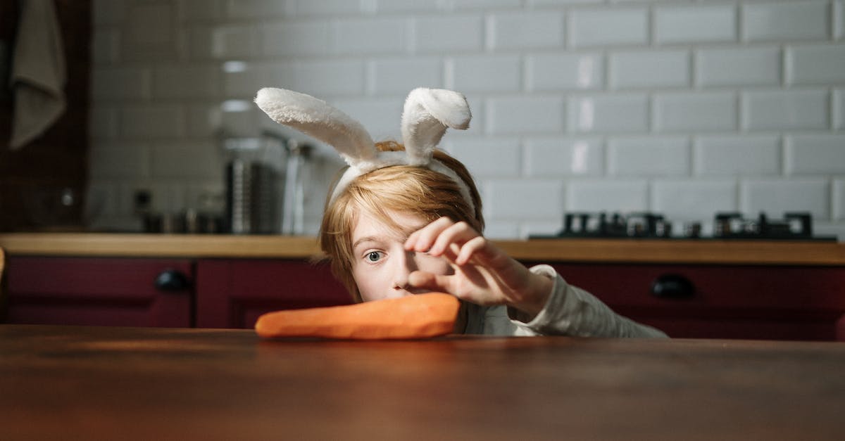 What do bunny carrots do? - Boy Grabbing Carrot on the Table What do bunny carrots do? - Boy Grabbing Carrot on the Table