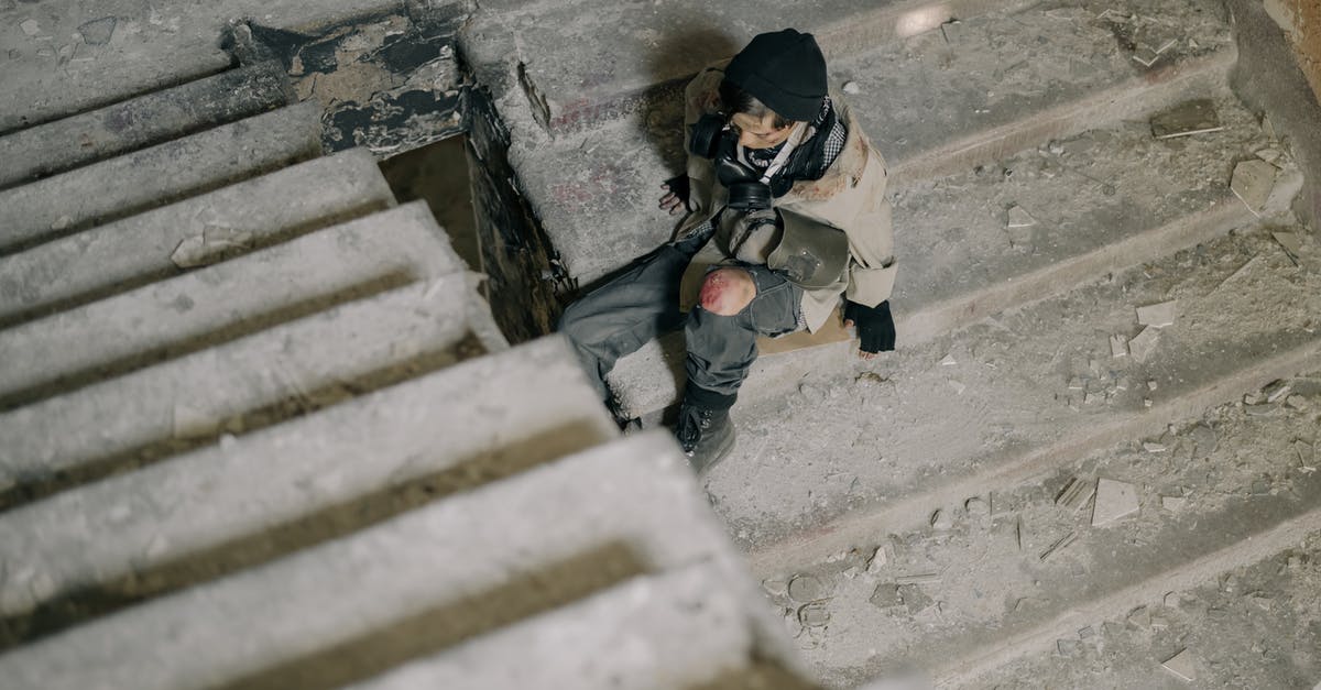 What do crowns above steps mean? - Man in White Jacket Climbing on Stairs What do crowns above steps mean? - Man in White Jacket Climbing on Stairs