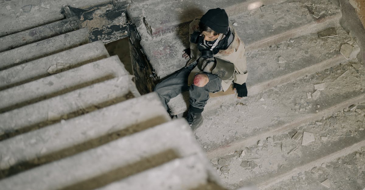 What do crowns above steps mean? - Man in White Jacket Climbing on Stairs