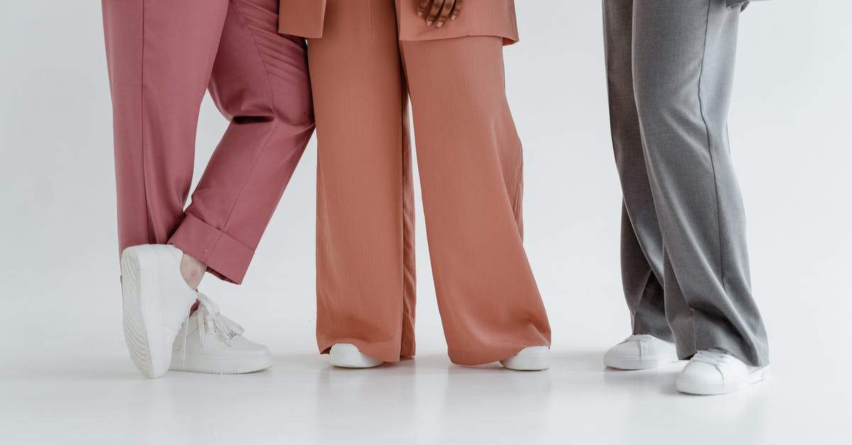 What do different pin colors mean? - Person in Gray Pants and Orange Blazer