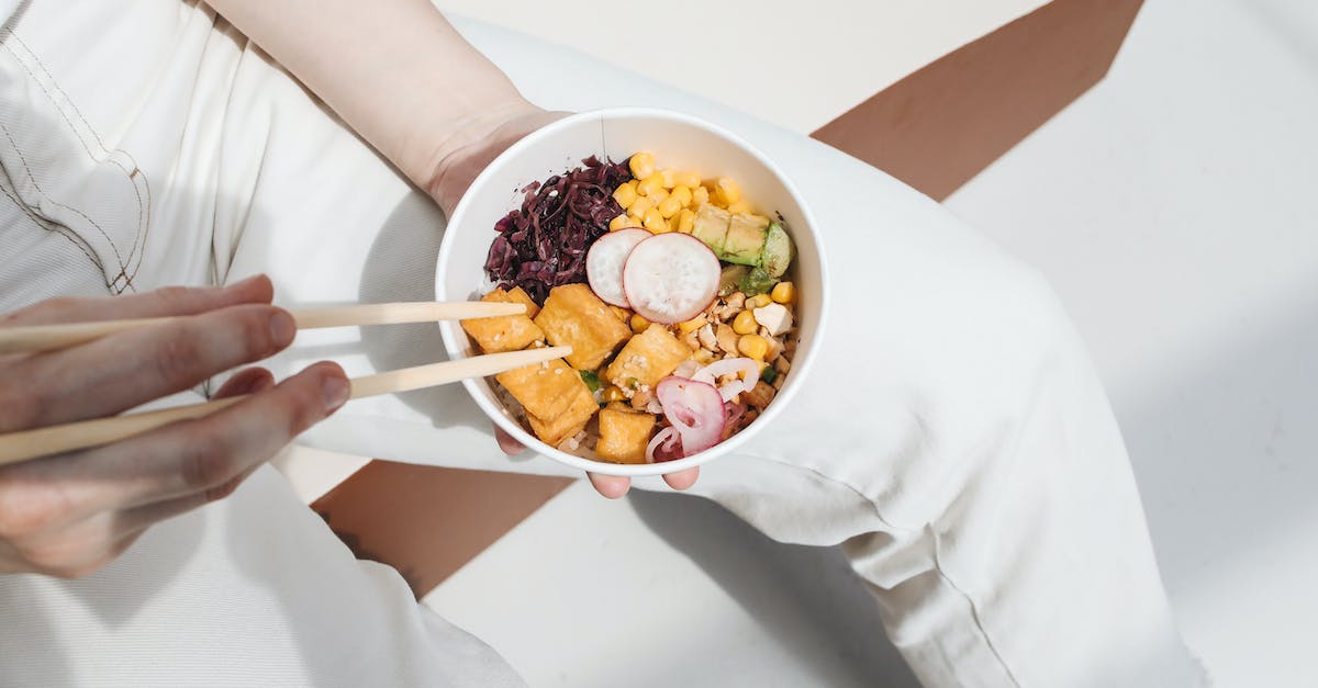 What do I get for getting Poke-Bank? - Photo of a Person Holding a Poke Bowl