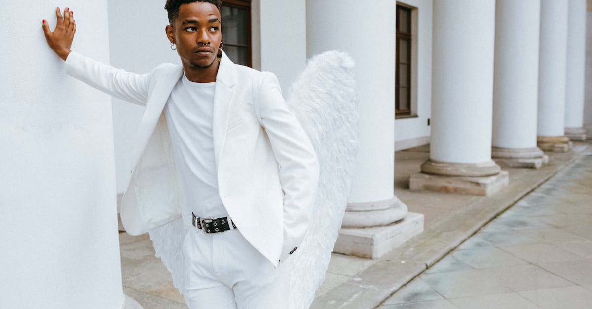 What do I lose by entering the Holy Pillar? - A Man Wearing an Angel Costume Leaning on a Pillar