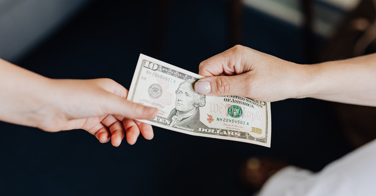 What do I need to bribe the Gravedigger in Vizima? - Hands Holding a 10 Dollar Bill What do I need to bribe the Gravedigger in Vizima? - Hands Holding a 10 Dollar Bill