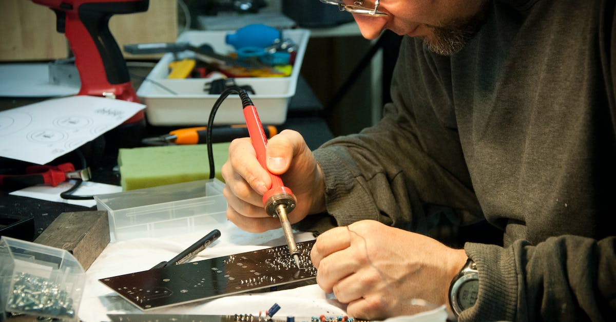 What do job colors mean? - Man Soldering Circuit Board