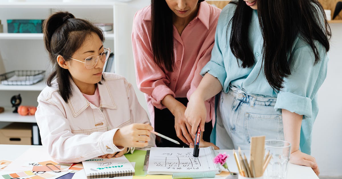 What do job colors mean? - A Woman Pointing at a Notebook using a Marker