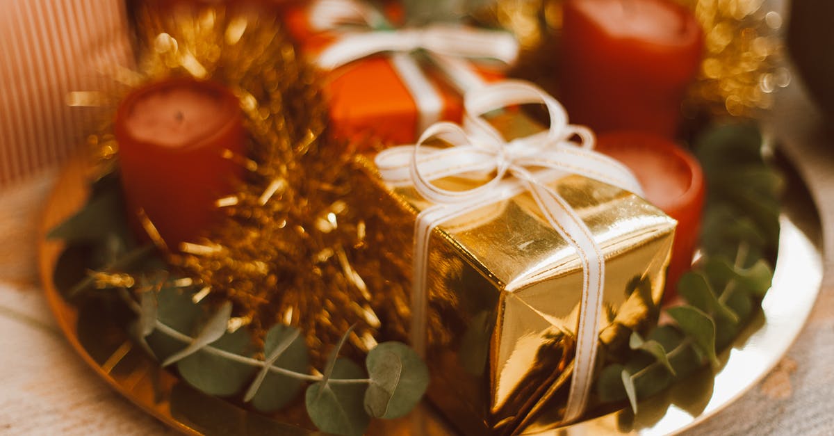 What do the green and red chevron indicators mean? - Brown and White Gift Box on Brown and White Round Table