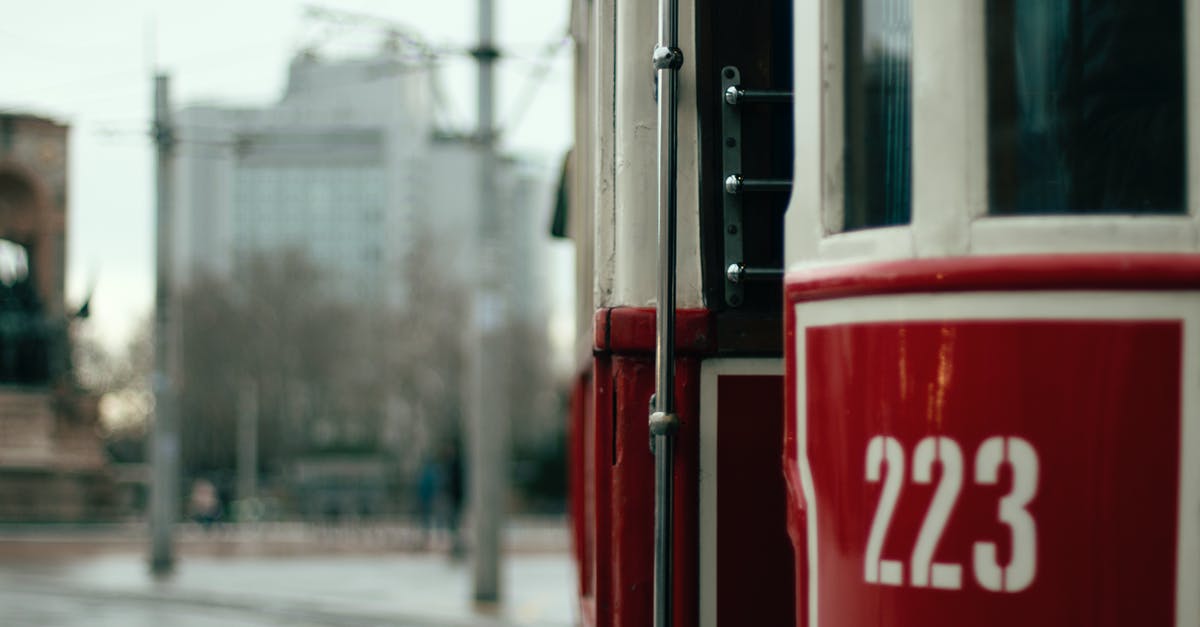 What do the numbers in brackets mean after City/Village on the RRT player aid card? - Free stock photo of architecture, blur, bus