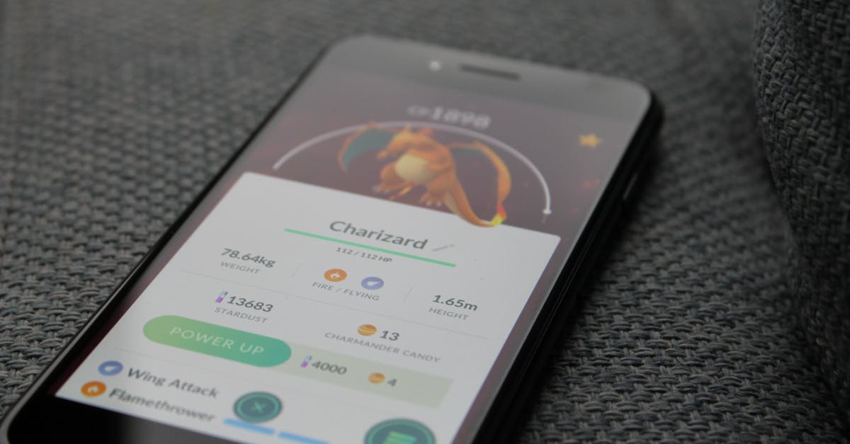 What do the Pokemon "Characteristics" mean? - Turned-on Iphone Displaying Pokemon Go Charizard Application