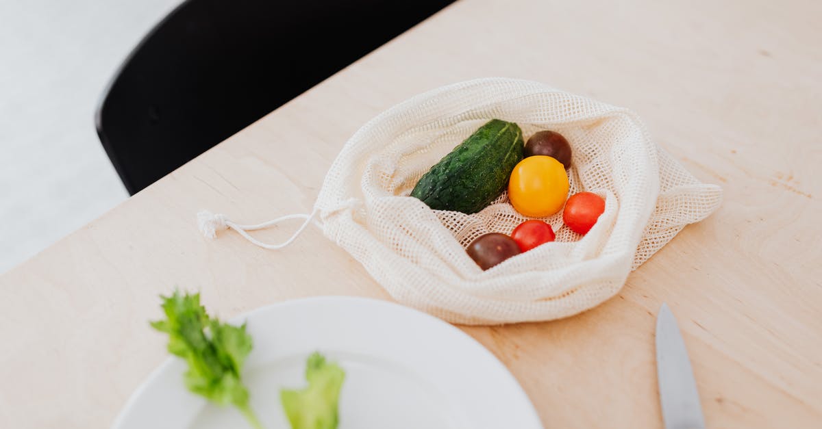 What do the tomatoes on the prize wheel do? - Multicoloured Vegetables in a Textile Bag on Table What do the tomatoes on the prize wheel do? - Multicoloured Vegetables in a Textile Bag on Table