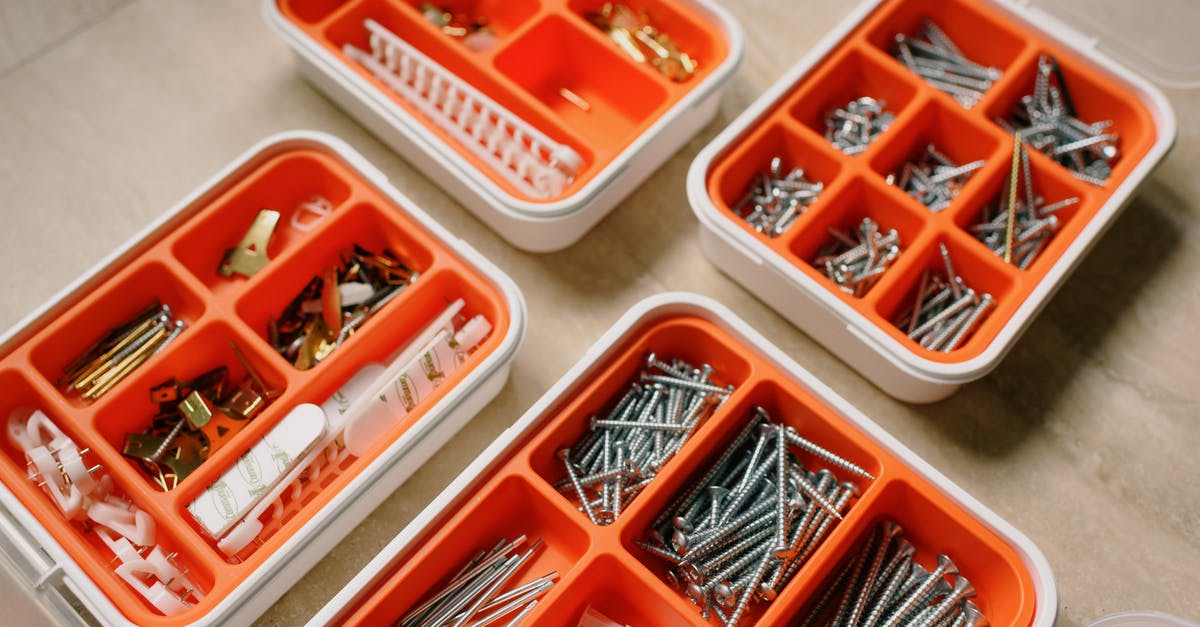 What do the various beers do? - From above of boxes with different metal nails and plastic dowels in workshop