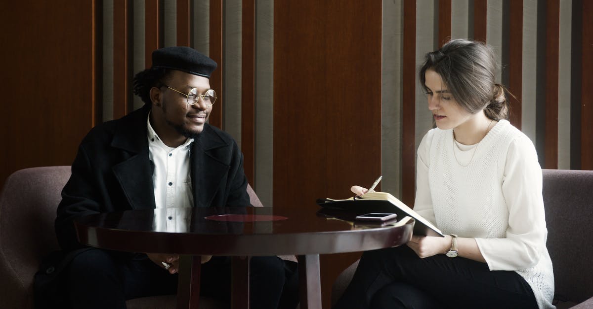 What do these strings in the NWN2 client extension readme mean? - Man in Blue Suit Jacket Sitting Beside Woman in White Dress Shirt