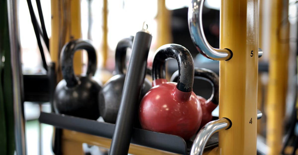What does Club Sets completion in Super Rush mean? - Set of different kettlebells placed in row on metal platform on modern fitness equipment in sport center What does Club Sets completion in Super Rush mean? - Set of different kettlebells placed in row on metal platform on modern fitness equipment in sport center