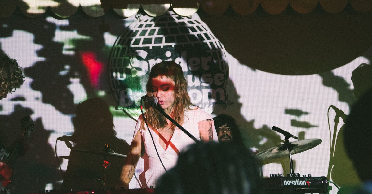 What does it mean when a shadow passes over the stage? - Woman Playing Electronic Keyboard While Singing What does it mean when a shadow passes over the stage? - Woman Playing Electronic Keyboard While Singing