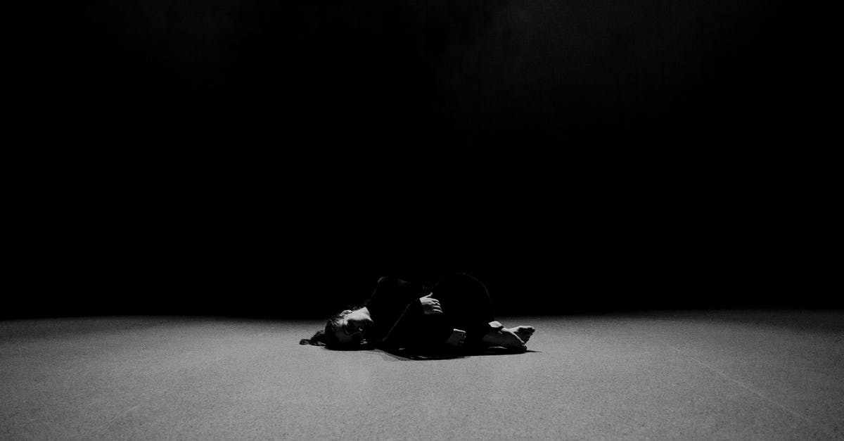 What does Just Dance 2017 score via Kinect? - Grayscale Photo of Man Lying on Ground