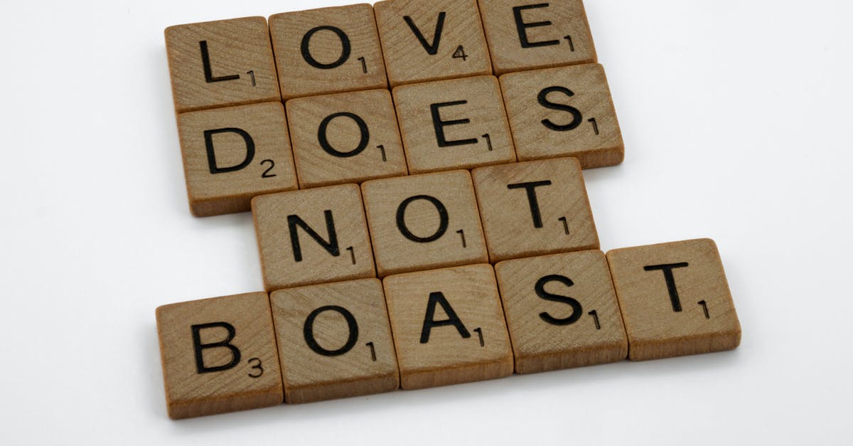 What does "immune to errors" mean? - Close-Up Shot of Scrabble Tiles on a White Surface What does "immune to errors" mean? - Close-Up Shot of Scrabble Tiles on a White Surface