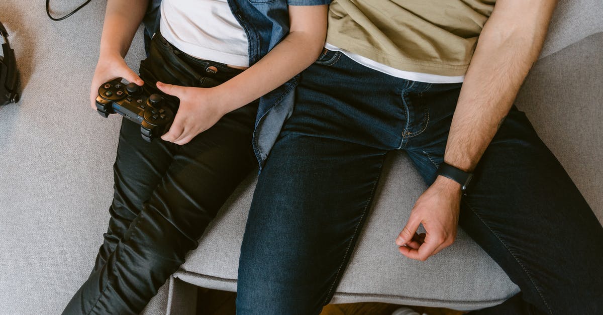 What does "players like you love this game" mean exactly? - Man in Blue Denim Jeans Sitting Beside Woman in White Shirt