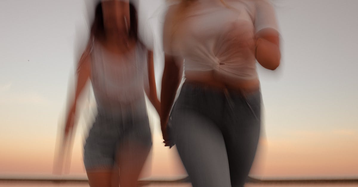 What does "royal adventure" spin mean in PUBG? - Crop blurred happy women in casual clothes holding hands while running on seashore against colorful sky What does "royal adventure" spin mean in PUBG? - Crop blurred happy women in casual clothes holding hands while running on seashore against colorful sky