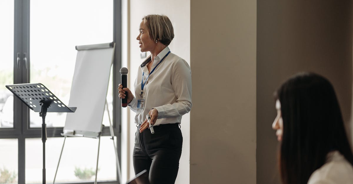 What does selecting a badge in the profile view in the scanner do? - A Woman Talking with a Microphone
What does selecting a badge in the profile view in the scanner do? - A Woman Talking with a Microphone