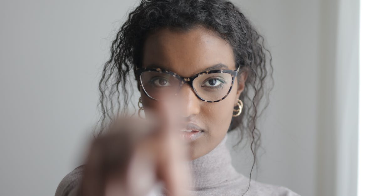 What does the arrow mean when you pick up a weapon? - Young ethnic woman pointing at camera