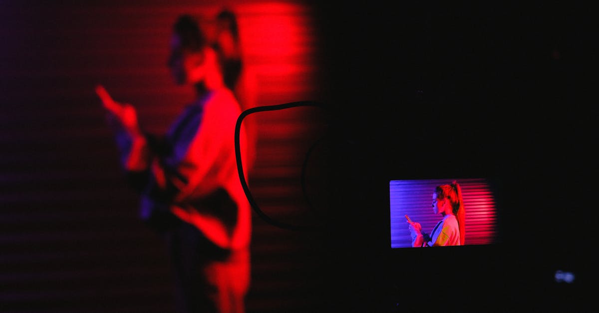 What does the Carbine do in A Dark Room and how do I use it? - Pensive female browsing smartphone while recording video on camera in dark room What does the Carbine do in A Dark Room and how do I use it? - Pensive female browsing smartphone while recording video on camera in dark room