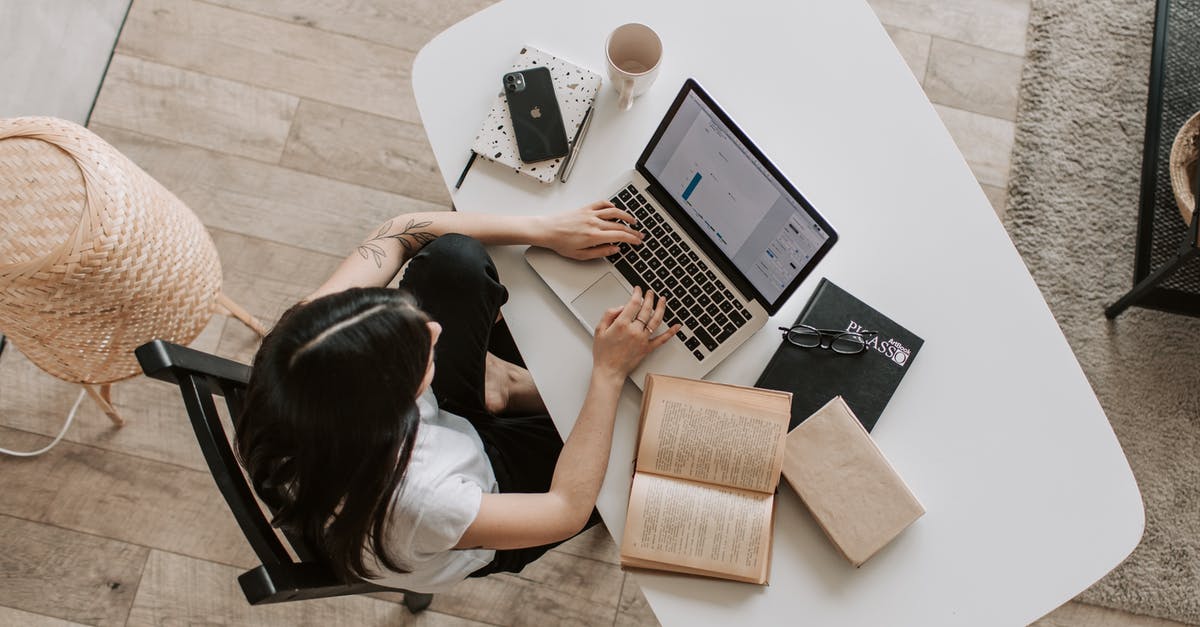 What does the distance to the Pokémon change? - Young lady typing on keyboard of laptop in living room What does the distance to the Pokémon change? - Young lady typing on keyboard of laptop in living room