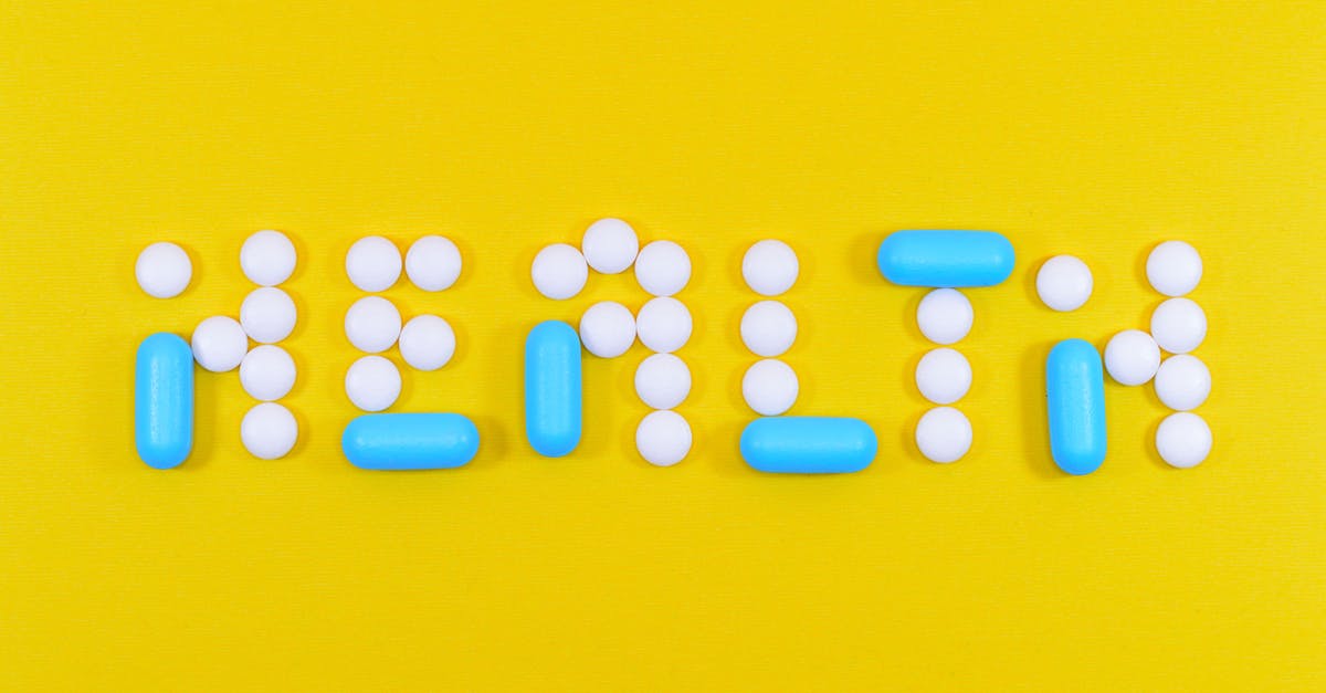 What does the flashing blue portion of the health bar mean? - White and Blue Health Pill and Tablet Letter Cutout on Yellow Surface What does the flashing blue portion of the health bar mean? - White and Blue Health Pill and Tablet Letter Cutout on Yellow Surface