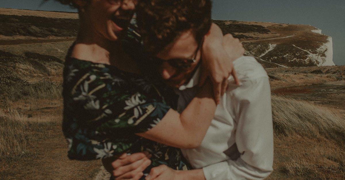 What does the frontline of units affect? - Selective Focus Photography of Woman Hugging Man
