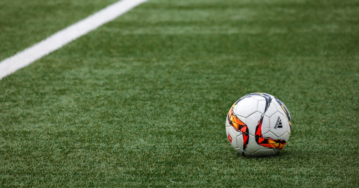 What does the green outline of the "preferred position" markers mean? - White Adidas Soccer Ball on Grass