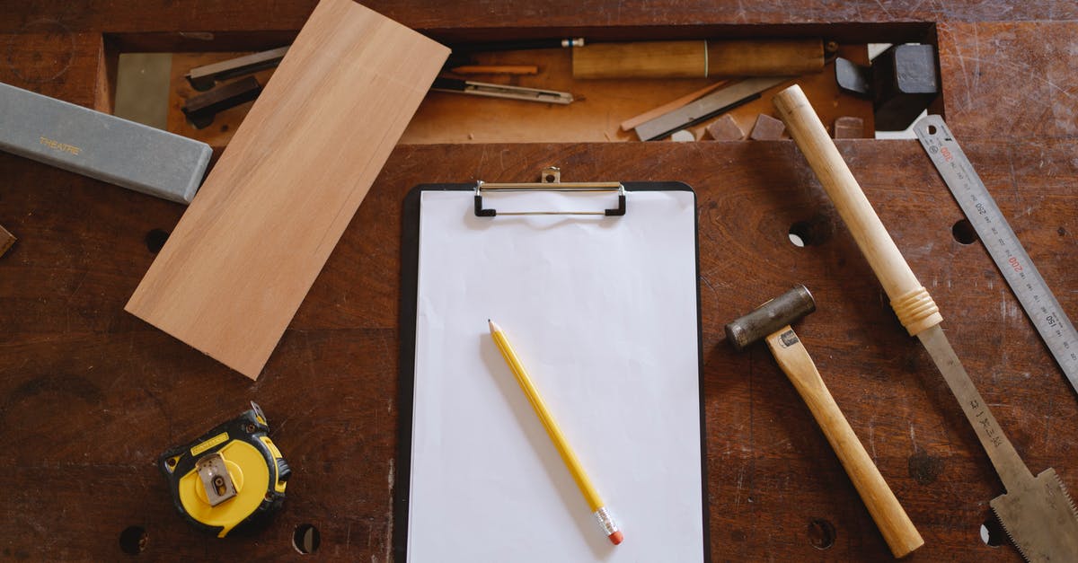 What does the hammer do? - Yellow Pencil on White Paper And Carpentry Tools What does the hammer do? - Yellow Pencil on White Paper And Carpentry Tools