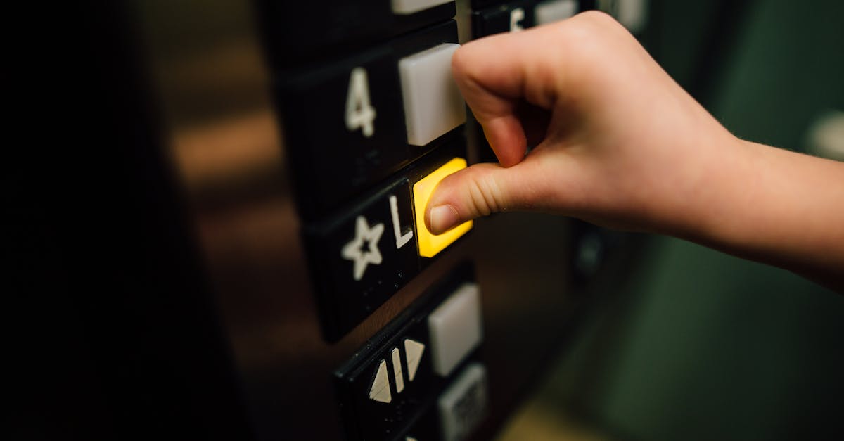 What does the level do? - Anonymous person pressing button of lift