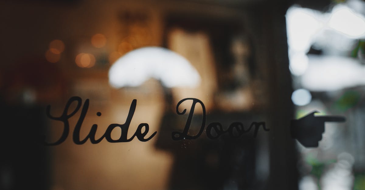 What does the Pirate and Nate say when trying to open the gate in Chapter 5? - Slide door inscription on glass entrance of modern cafe against blurred interior during daytime