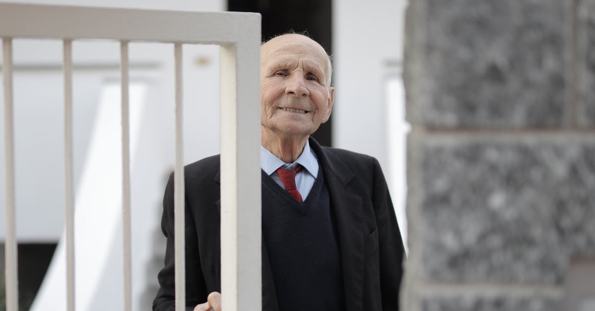 What does the Pirate and Nate say when trying to open the gate in Chapter 5? - Man in Black Suit Jacket Standing Beside Metal Gate