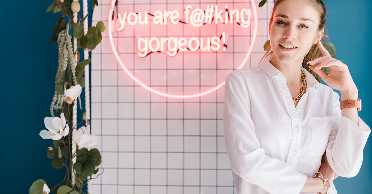 What does the "Minecraft" Achievement button do? - Woman Posing Near Pink Neon Sign 