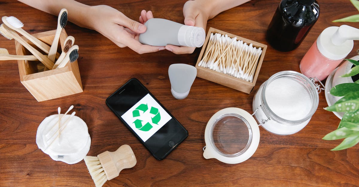 What does the Recycling Box do? - Crop person taking recycling tube of cosmetics