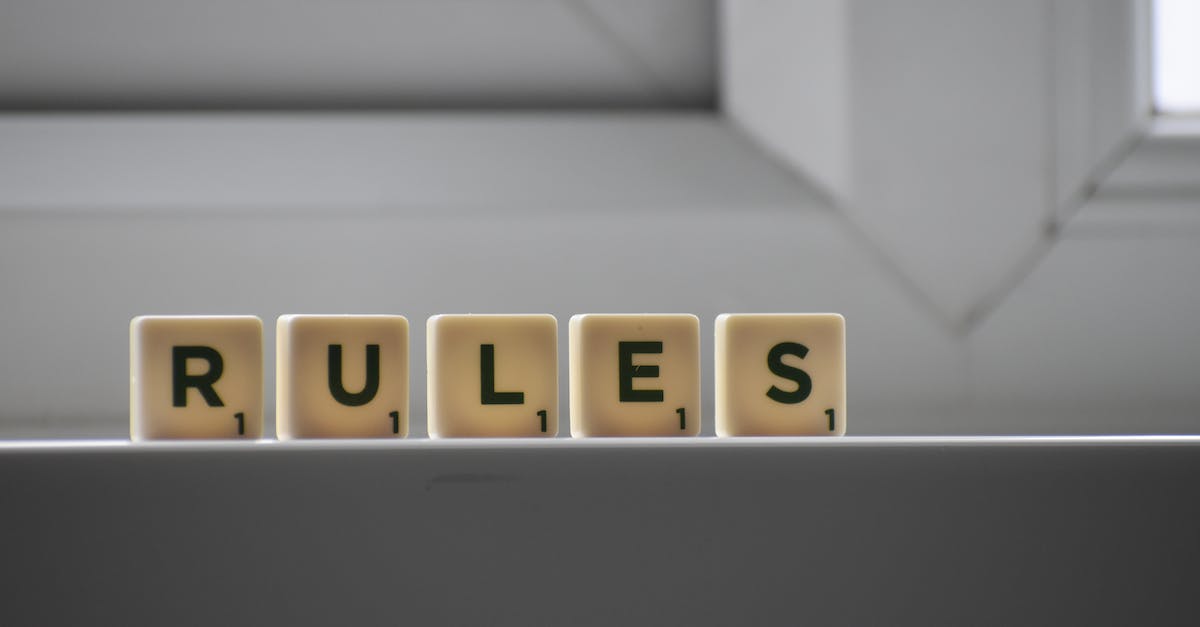 What does the small number when switching characters means? [duplicate] - Identical small square shaped cubes with RULES title and numbers on white windowsill near window in house in daylight