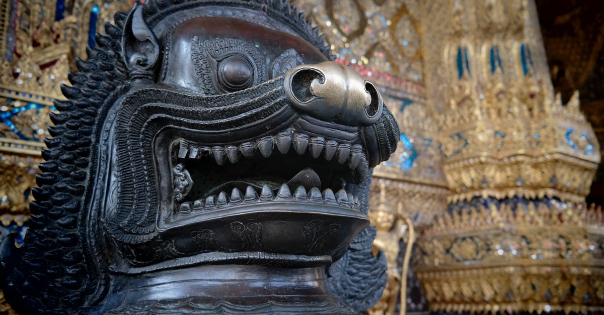 What does the sphere on the dragon mean? - Black Dragon Statue in Close Up Photography