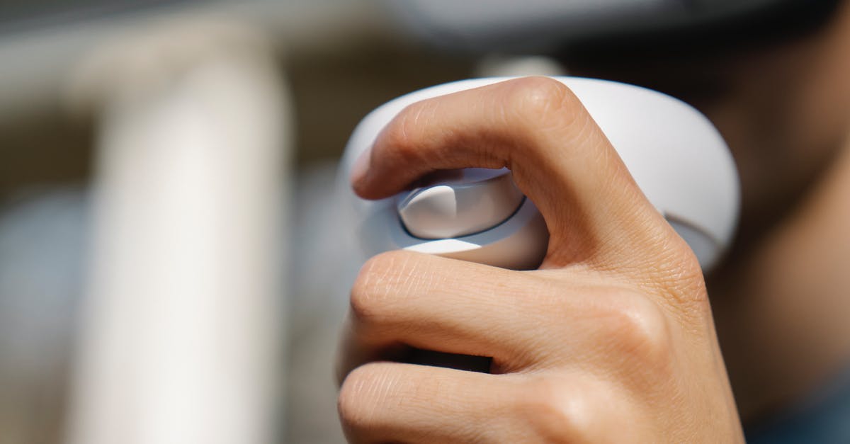 What does the upgrade button in the advanced warfare building do? - Crop person holding modern wireless controller