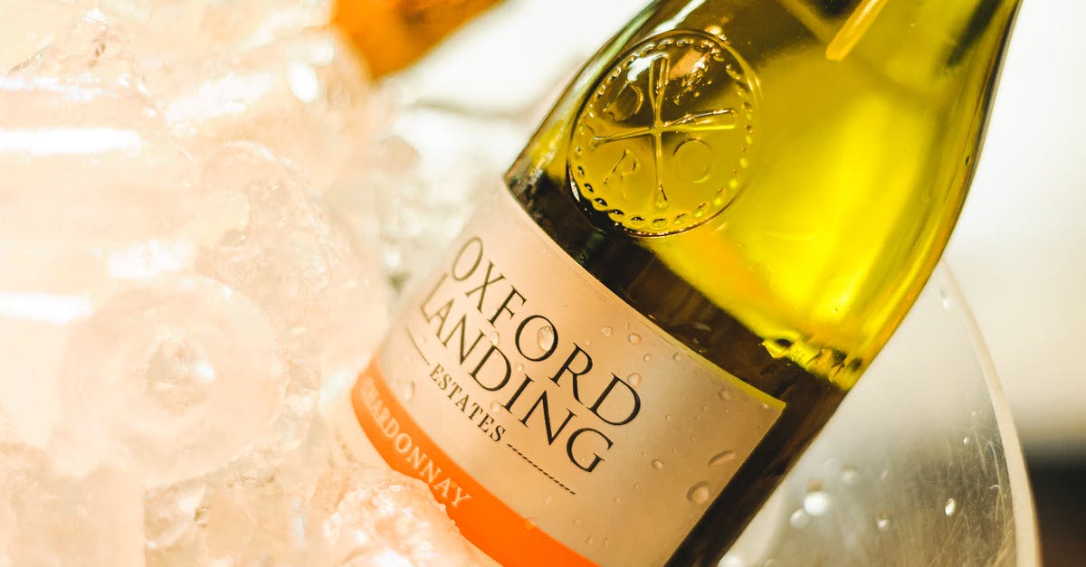 What does this text in the ice say? - Glass bottle of wine with text on label served in transparent bowl with ice What does this text in the ice say? - Glass bottle of wine with text on label served in transparent bowl with ice
