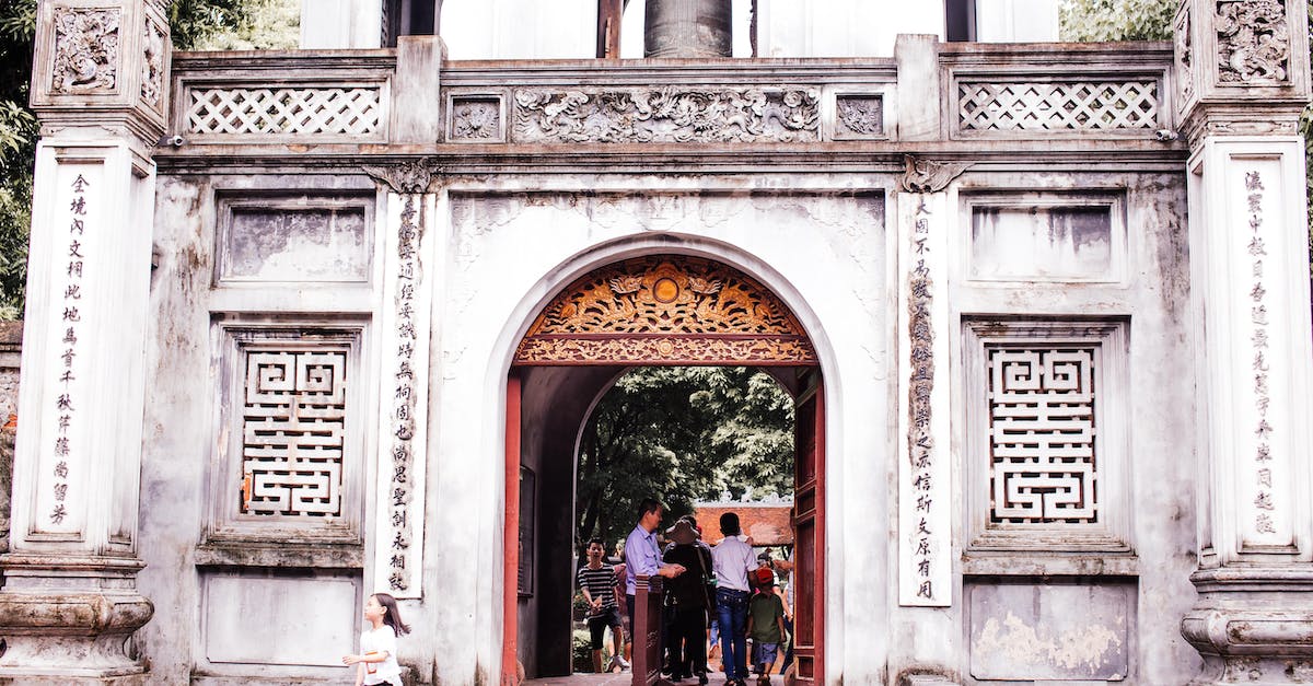 What does upgrading characters do in the Clash of Castles update? - People Walking on Sidewalk Near White Concrete Building