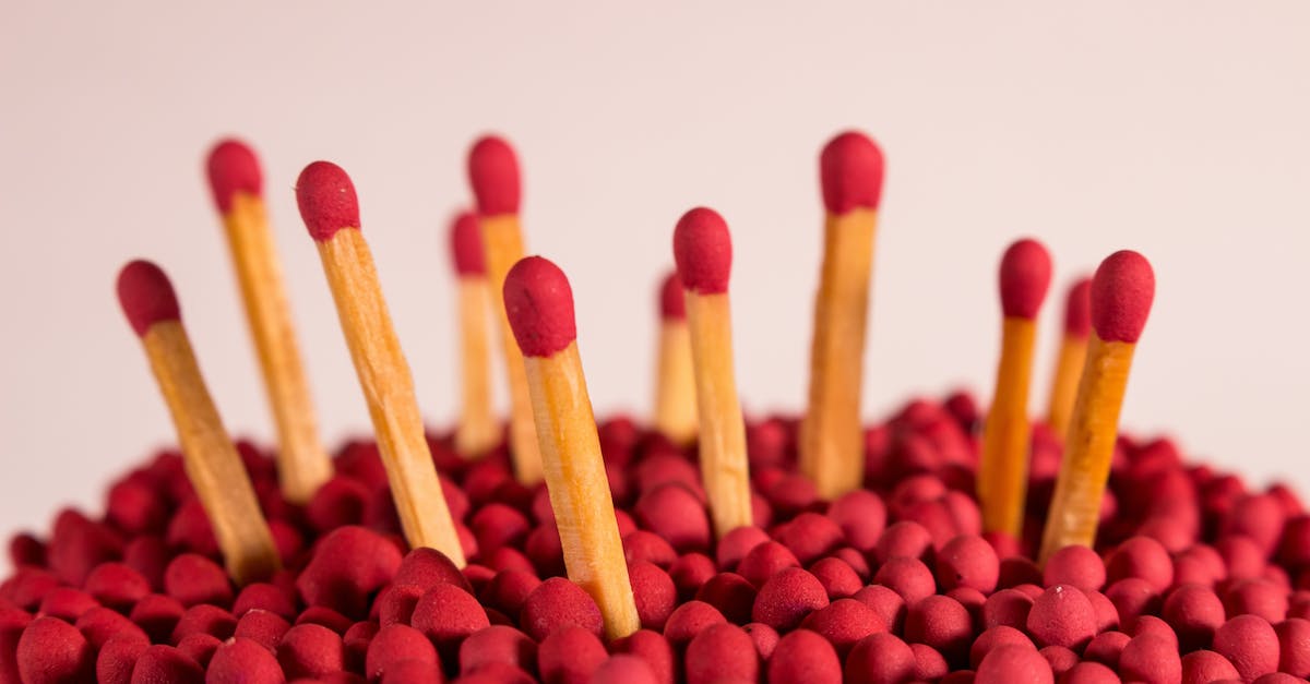 What effect do the power ups have? - High angle of unused wooden matchsticks with red sulfured heads against white background