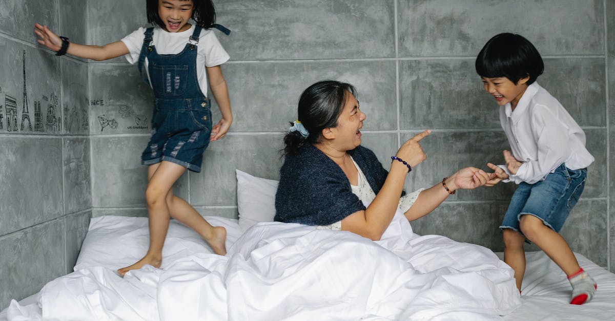 What effect does galaxy age have during game generation? - Cheerful elderly woman with playful kids on bed