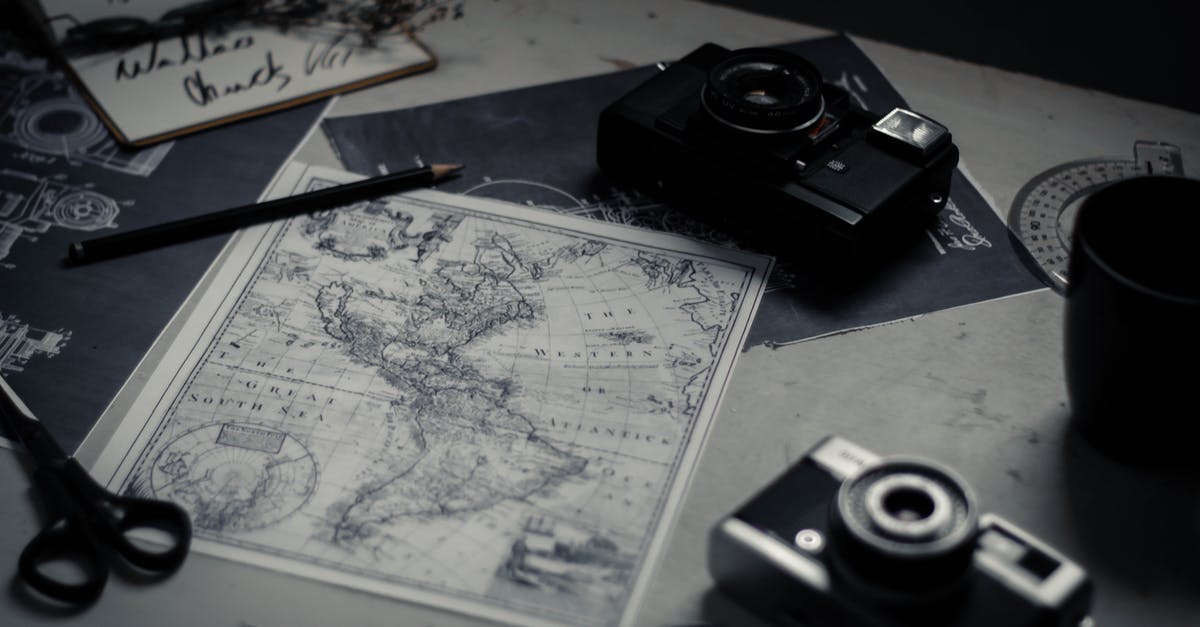 What elements of Renowned Explorers: International Society persist through multiple playthroughs? - Electronic devices and paper map on table What elements of Renowned Explorers: International Society persist through multiple playthroughs? - Electronic devices and paper map on table
