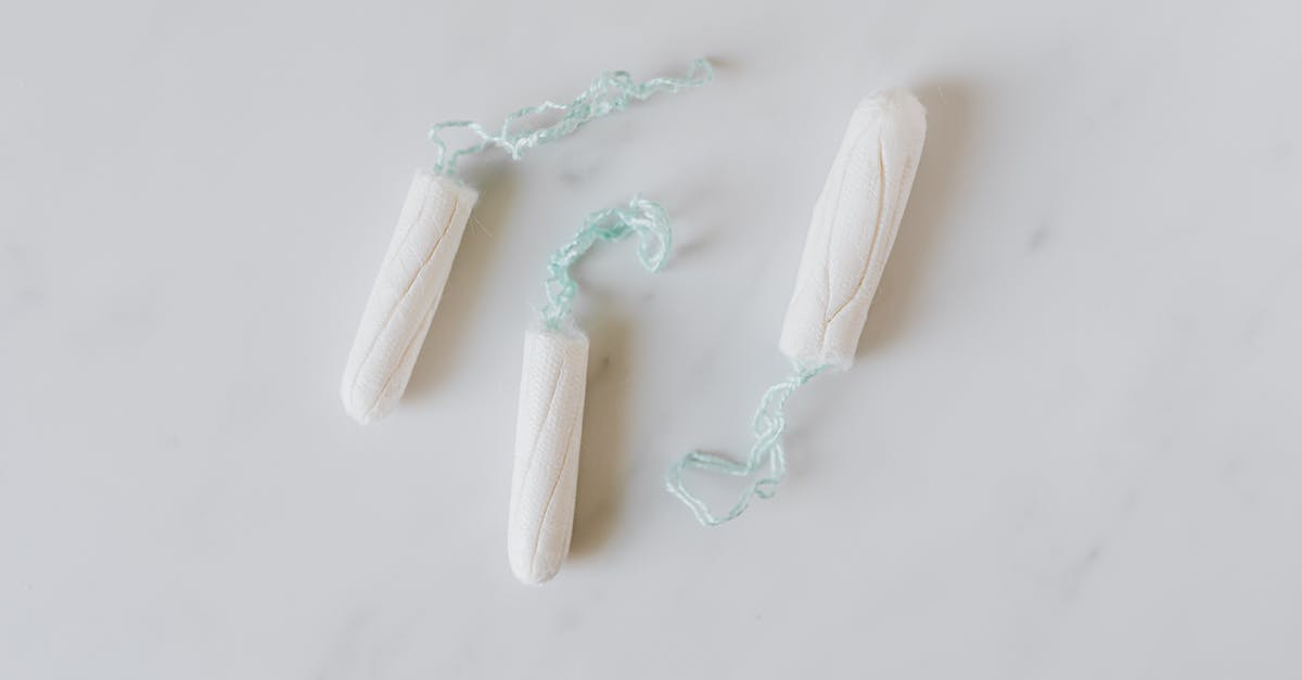 What exactly is a Humble Monthly Sneak Peek? - Top view of three hygienic cotton tampons placed on white marble patterned surface