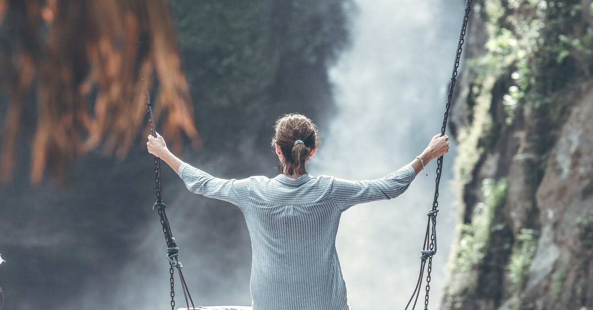 What exactly is "Park Balance Bonus"? - Woman Riding Big Swing in Front of Waterfalls