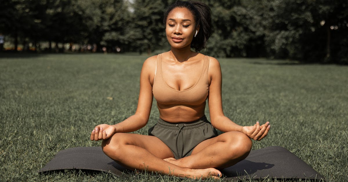 What exactly is "Park Balance Bonus"? - Fit ethnic woman practicing yoga in park