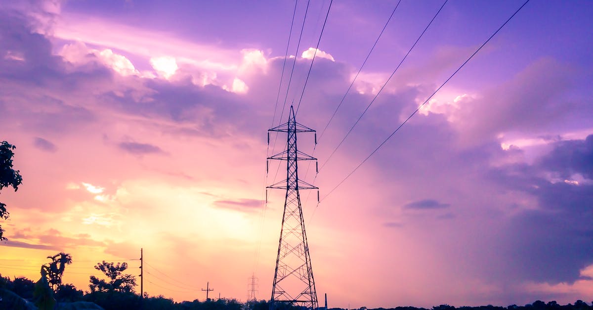 What, exactly, is transferred along supply lines? - Photography of Electric Tower during Sunset