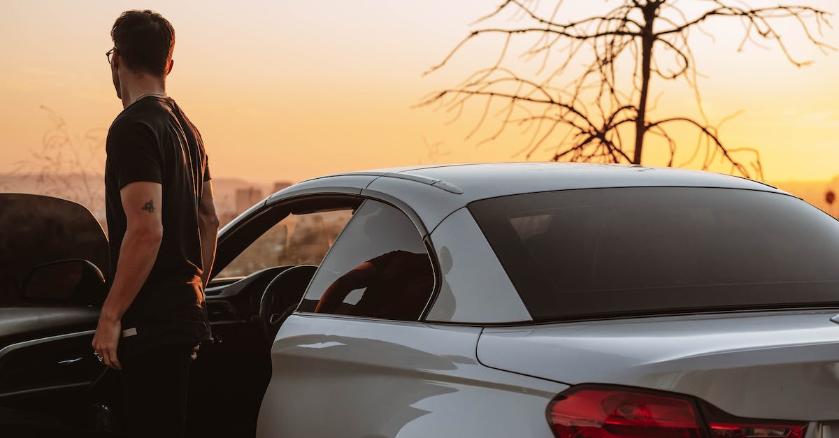 what exactly makes the car stealthy? - Man in Black Suit Standing Beside White Sedan during Sunset