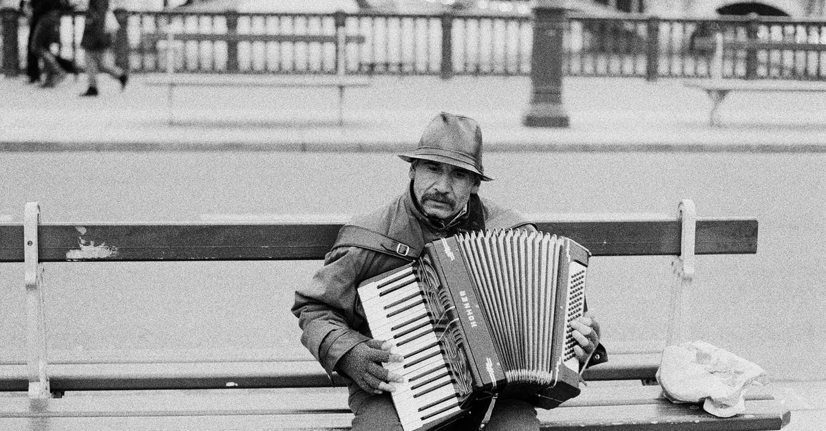 What exactly triggers the music change? - Man Sitting on a Bench and Playing Accordion What exactly triggers the music change? - Man Sitting on a Bench and Playing Accordion