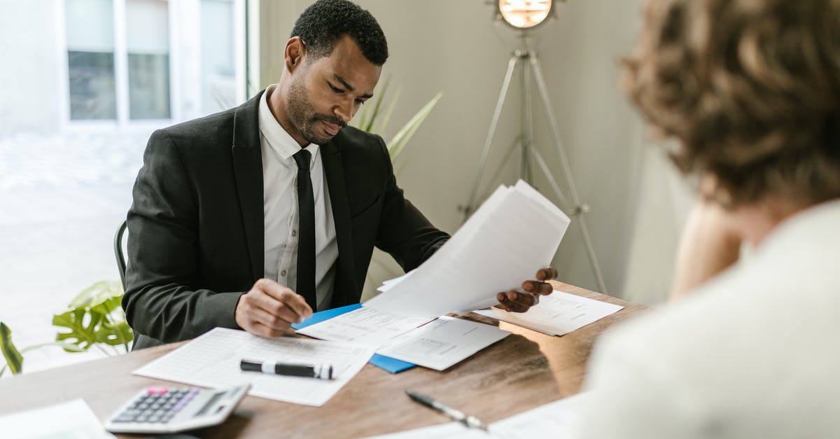 What factors should be considered when choosing one agent over another? - Professional Man looking at Papers What factors should be considered when choosing one agent over another? - Professional Man looking at Papers